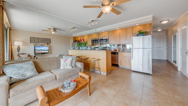 interior space with ceiling fan