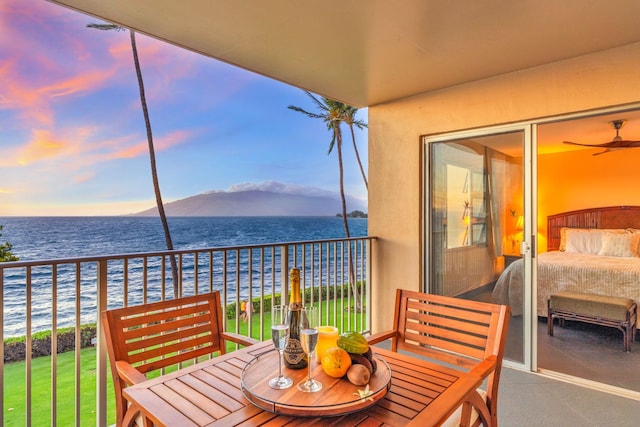 balcony featuring a water view