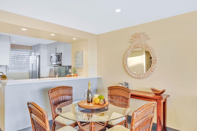 dining space with recessed lighting