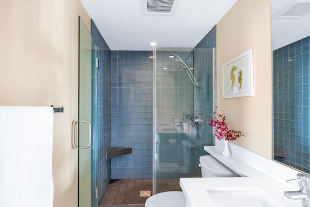 full bathroom featuring visible vents, toilet, and a stall shower