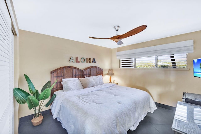 bedroom with baseboards and ceiling fan