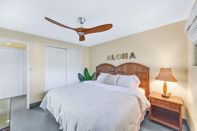 bedroom featuring a ceiling fan, a closet, and baseboards