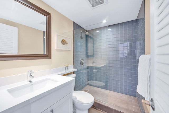 bathroom featuring visible vents, walk in shower, toilet, recessed lighting, and vanity