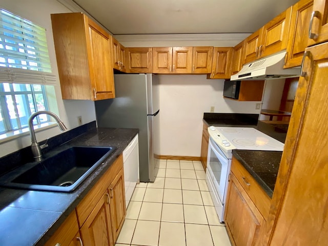 kitchen with ornamental molding, white appliances, light tile patterned flooring, and sink