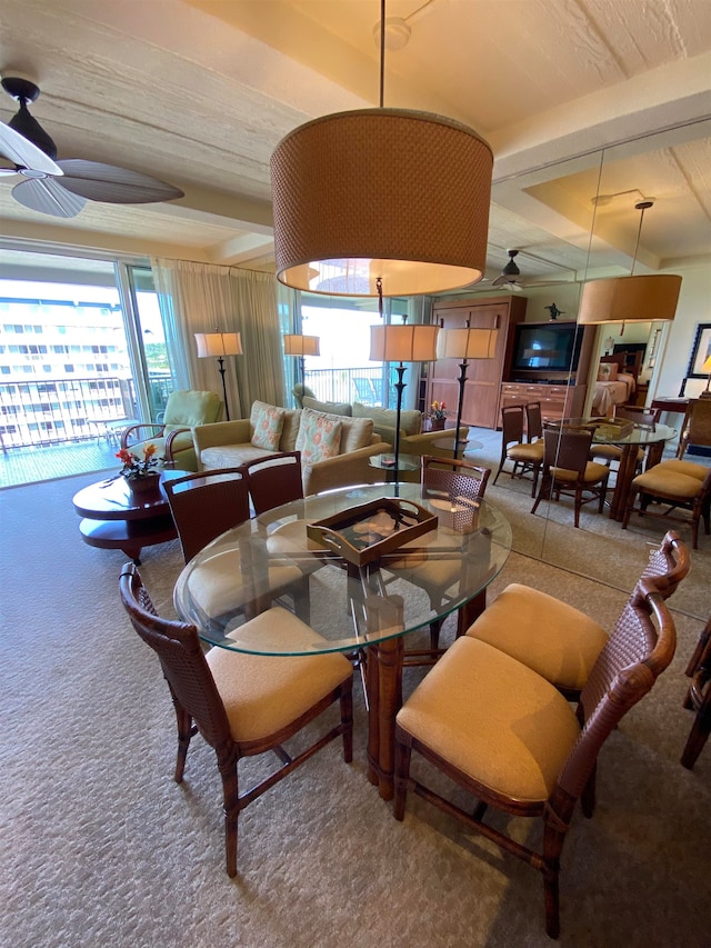 living room with plenty of natural light, ceiling fan, and carpet flooring