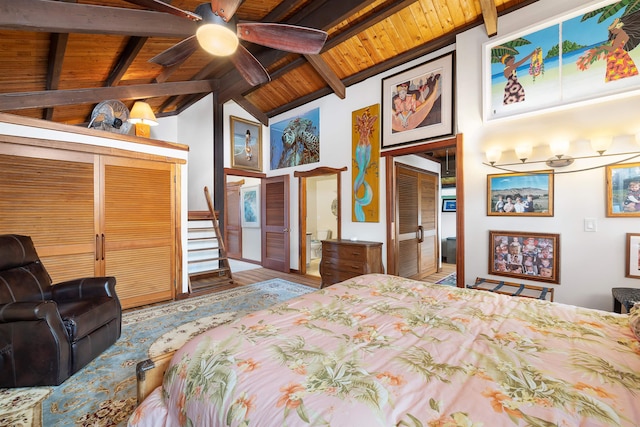 bedroom with vaulted ceiling with beams, ceiling fan, wooden ceiling, and a closet