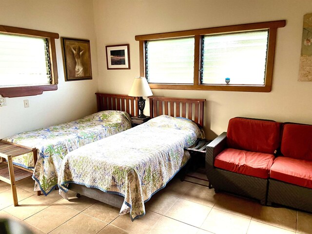 140 Waikoloa Rd, Hana, HI 96713 - tiled bedroom featuring multiple windows
