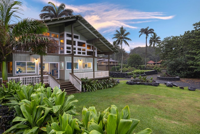 yard at dusk with a wooden deck