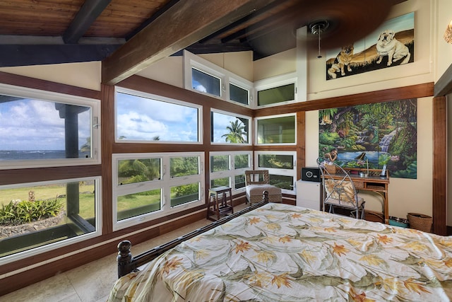 tiled bedroom with lofted ceiling with beams and wooden ceiling