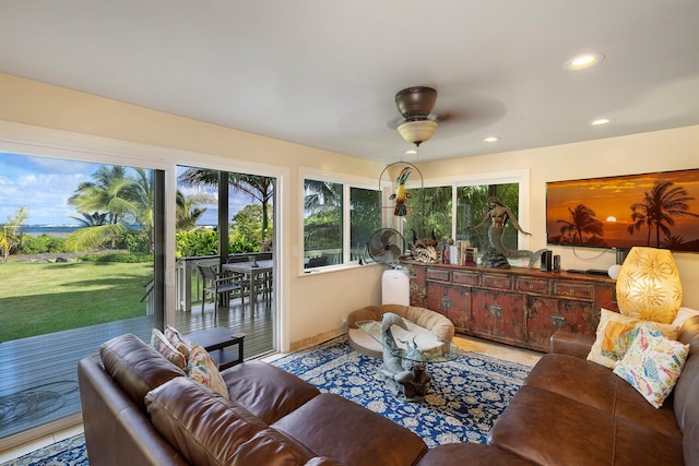 sunroom / solarium featuring ceiling fan