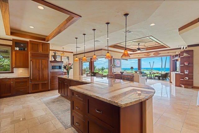 85 Lau Awa Pl, Lahaina, HI 96761 - kitchen featuring a tray ceiling, built in appliances, hanging light fixtures, recessed lighting, and ornamental molding