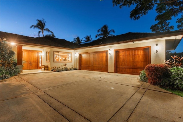 view of front of home with a garage