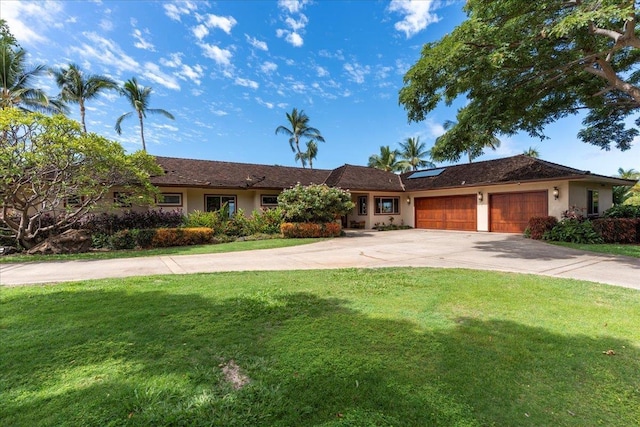85 Lau Awa Pl, Lahaina, HI 96761 - single story home with solar panels, a front yard, a garage, and driveway