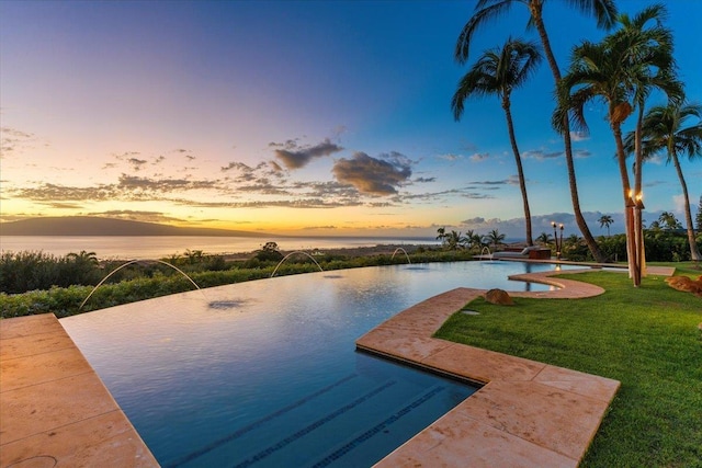 85 Lau Awa Pl, Lahaina, HI 96761 - view of pool featuring a yard, an infinity pool, and a water view