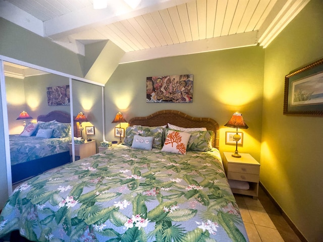 tiled bedroom featuring beamed ceiling and wood ceiling