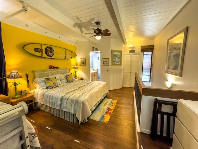 bedroom featuring ensuite bath, beamed ceiling, ceiling fan, and dark hardwood / wood-style floors