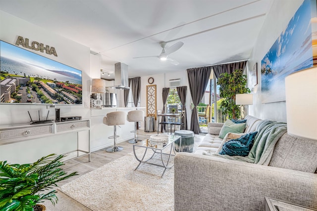 1002 S Kihei Rd Unit 205, Kihei, HI 96753 - living area with wood finished floors and a ceiling fan