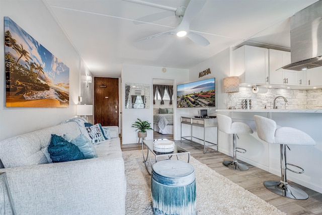 1002 S Kihei Rd Unit 205, Kihei, HI 96753 - living area featuring light wood-type flooring and a ceiling fan