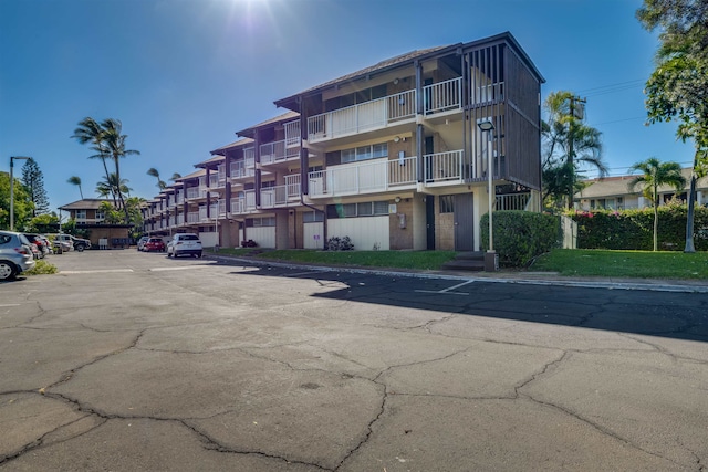 1002 S Kihei Rd Unit 205, Kihei, HI 96753 - view of apartment building / complex featuring uncovered parking
