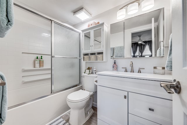 1002 S Kihei Rd Unit 205, Kihei, HI 96753 - full bath with vanity, toilet, combined bath / shower with glass door, and wood finished floors