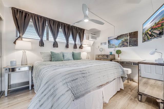 1002 S Kihei Rd Unit 205, Kihei, HI 96753 - bedroom with wood finished floors, a wall mounted air conditioner, and a ceiling fan
