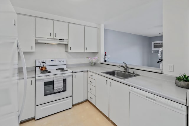 kitchen with white cabinetry, sink, white appliances, and a wall mounted air conditioner