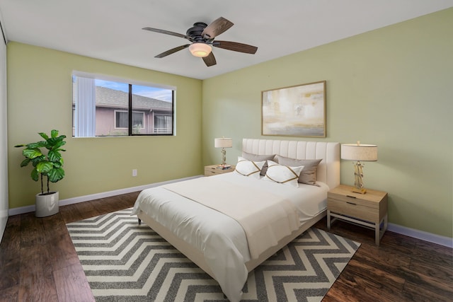 bedroom with ceiling fan and dark wood-type flooring