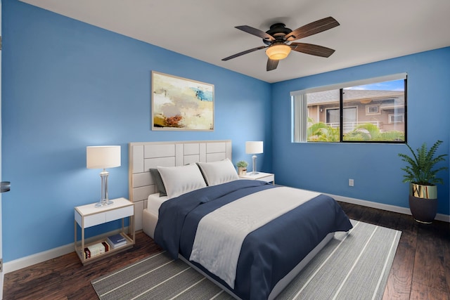 bedroom featuring ceiling fan and dark wood-type flooring