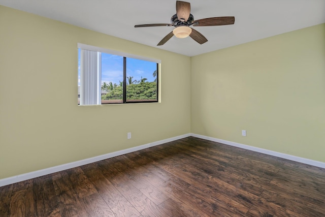 empty room featuring ceiling fan and dark hardwood / wood-style floors