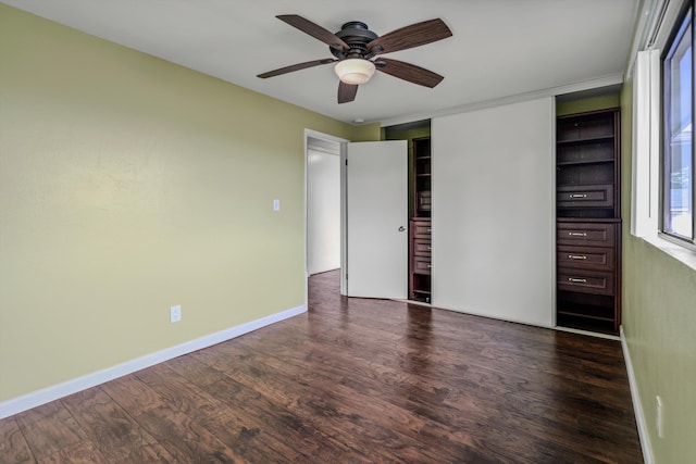 unfurnished bedroom with ceiling fan, a closet, and dark hardwood / wood-style floors