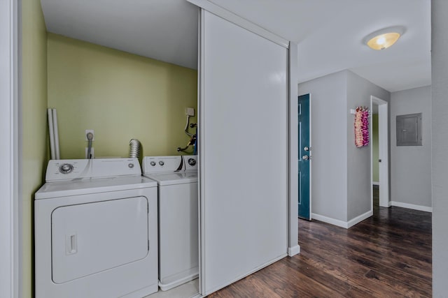 washroom with electric panel, dark hardwood / wood-style floors, and washing machine and dryer