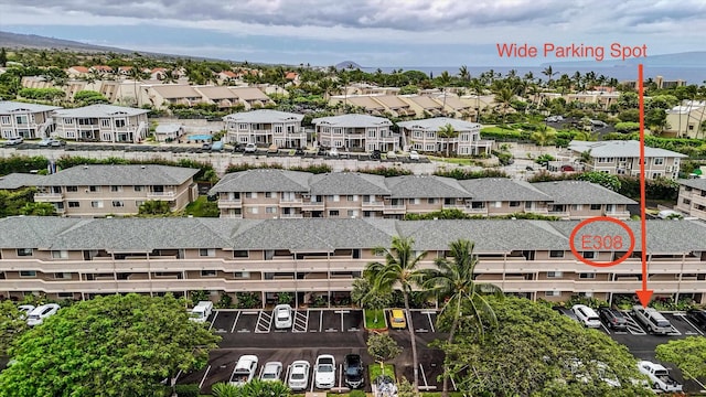 birds eye view of property with a mountain view