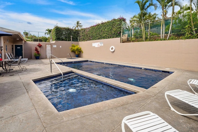 view of swimming pool featuring a patio