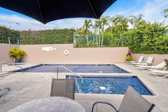 view of pool featuring a patio