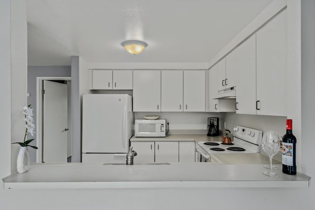 kitchen featuring sink, white cabinets, and white appliances