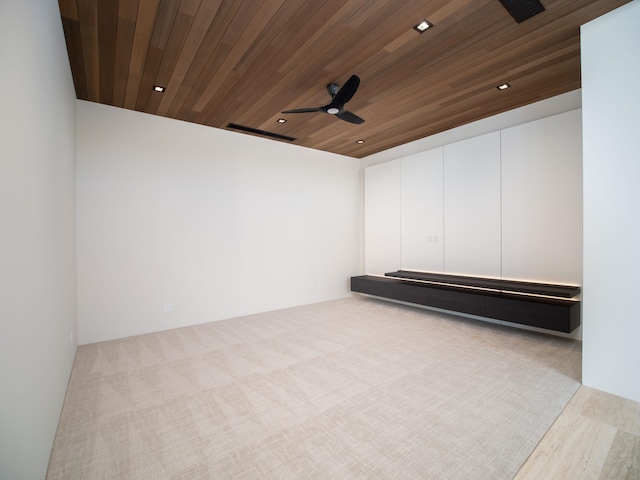 unfurnished room featuring light hardwood / wood-style floors, ceiling fan, and wood ceiling