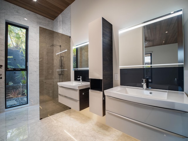 bathroom with tiled shower, tile flooring, double sink, wood ceiling, and large vanity