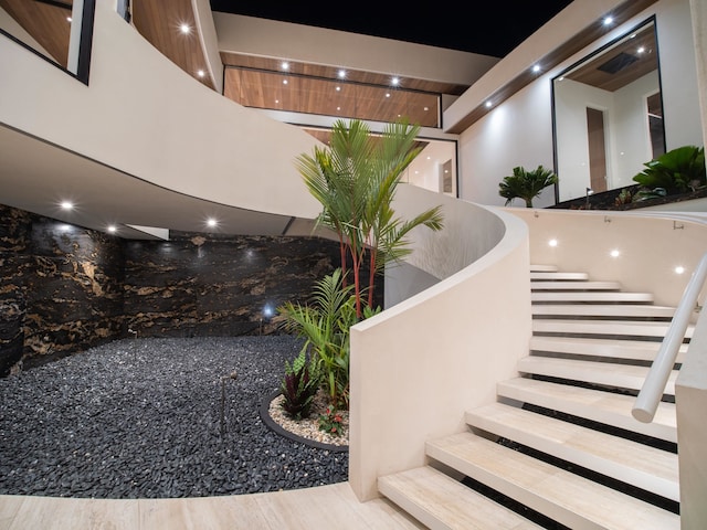 stairway featuring light wood-type flooring