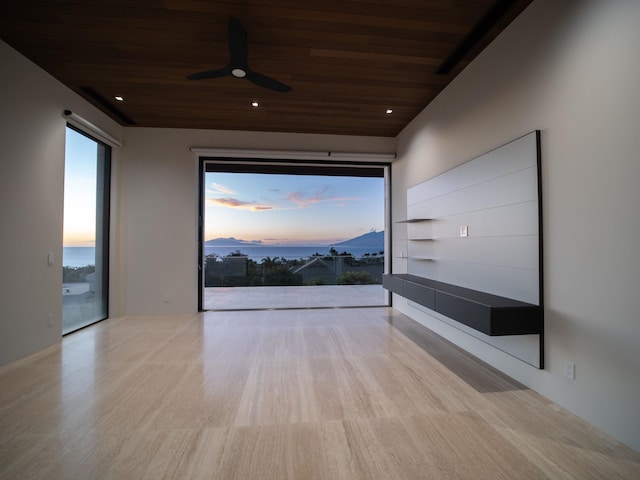 unfurnished room featuring wooden ceiling and ceiling fan