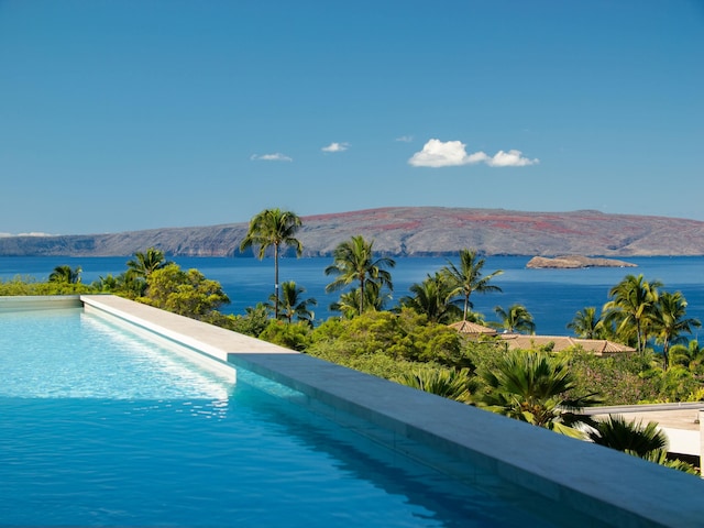 view of swimming pool featuring a mountain view