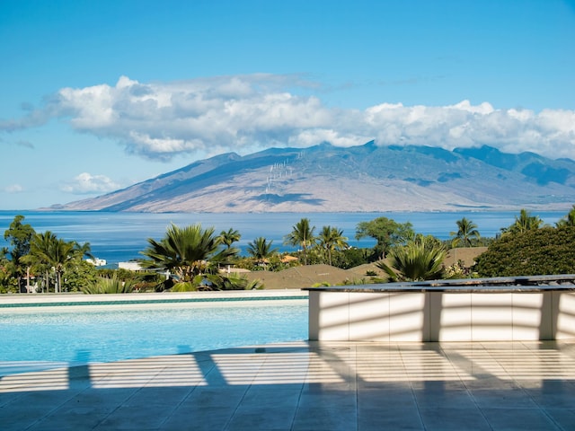 view of pool with a mountain view