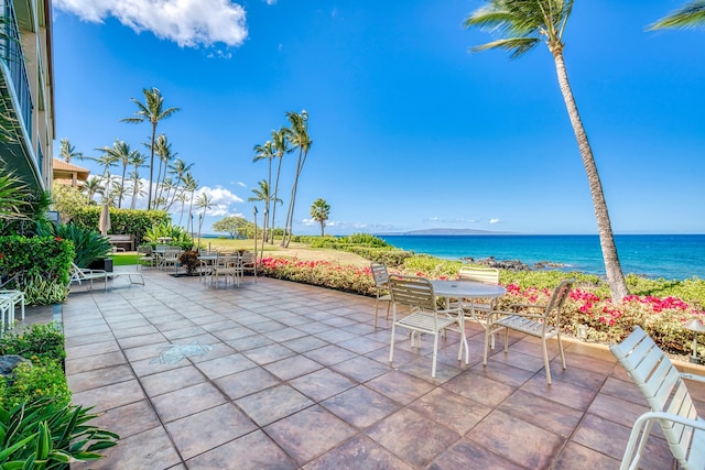 view of patio with a water view