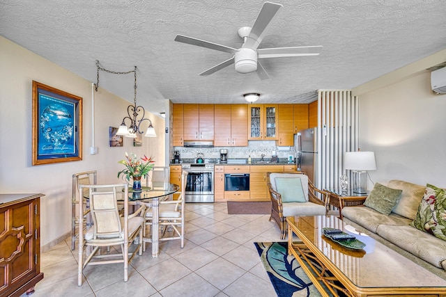 kitchen featuring a textured ceiling, stainless steel appliances, and tasteful backsplash