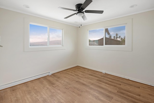 empty room featuring crown molding, baseboards, ceiling fan, a baseboard radiator, and light wood-style flooring