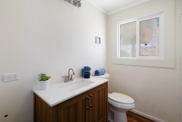 half bath featuring toilet and vanity
