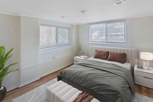 bedroom featuring wood finished floors