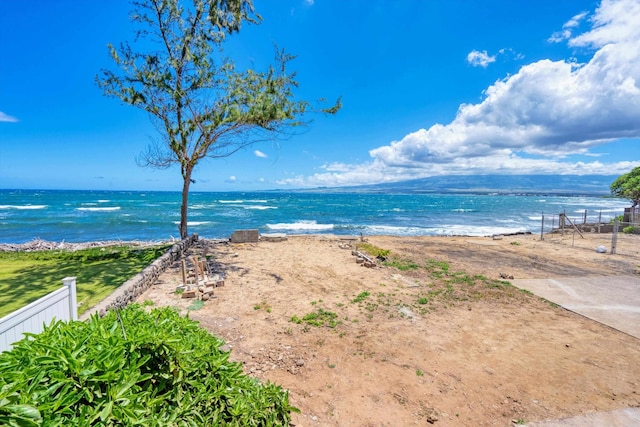 water view with a view of the beach and fence