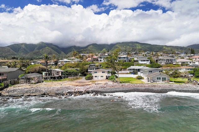 mountain view featuring a residential view and a water view