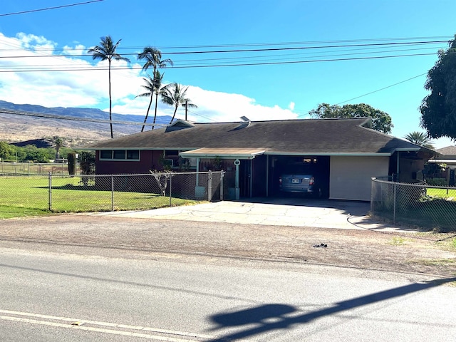 ranch-style house with a mountain view and a front lawn