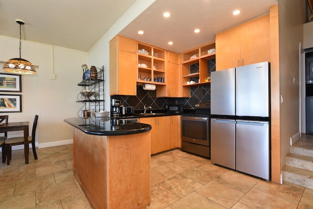 kitchen featuring light brown cabinets, tasteful backsplash, kitchen peninsula, pendant lighting, and appliances with stainless steel finishes